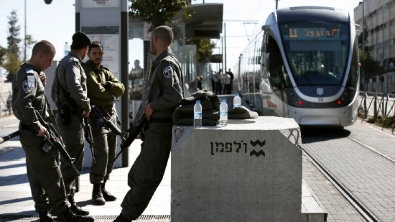 Palestinian who ran over three soldiers turns himself in