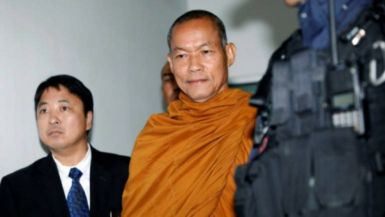 Firebrand Thai monk charged over amulet fraud