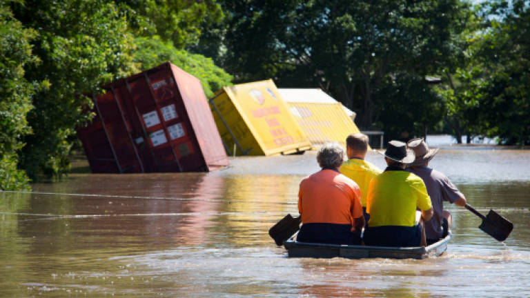 Australia floods still rising with two dead, four missing