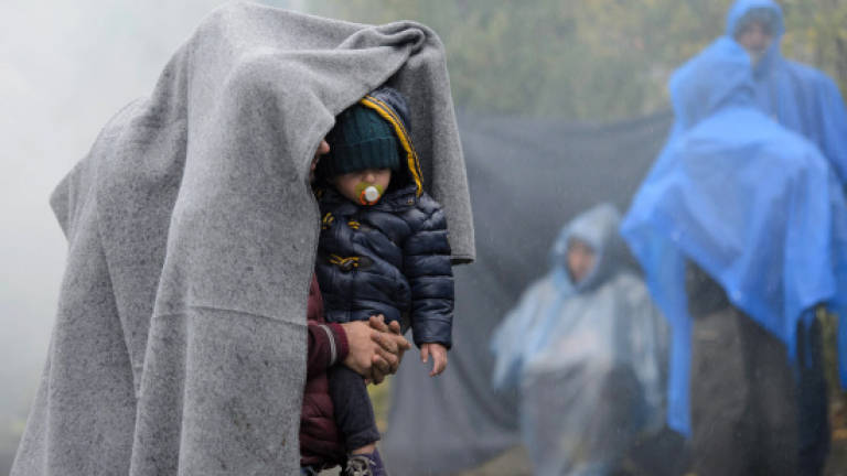 EU calls mini summit as Balkans buckle under refugee crisis