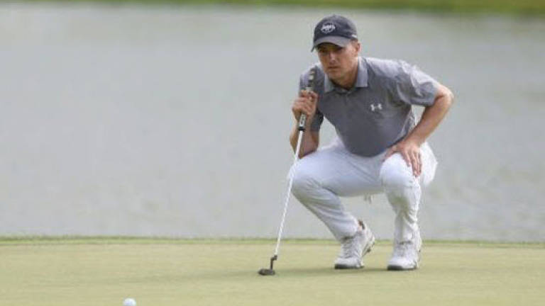 Spieth, Johnson share Travellers lead with McIlroy one back