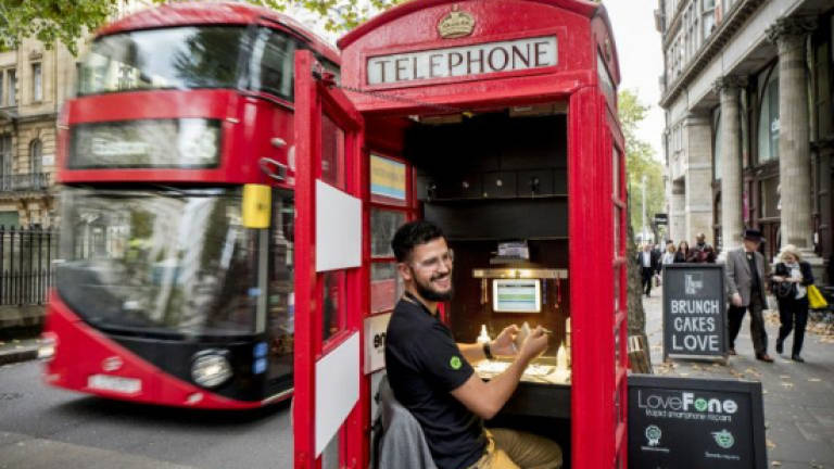 Britain's iconic red phone boxes ring the changes