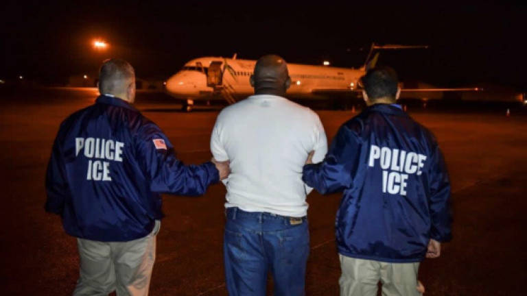 US agents conduct first Trump-era raids targeting undocumented migrants