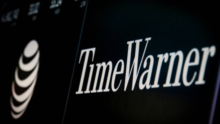 AT&amp;T closes mega-merger with Time Warner
