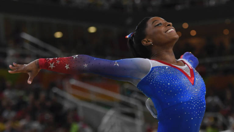Biles bows out with four gold and name in lights