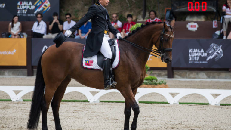 Siblings Qabil, Quzandria come out of retirement to win team dressage gold