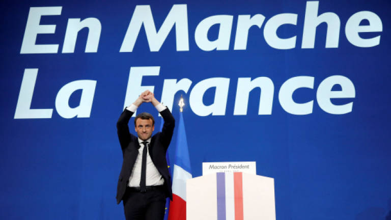 Macron, Le Pen set for French election run-off