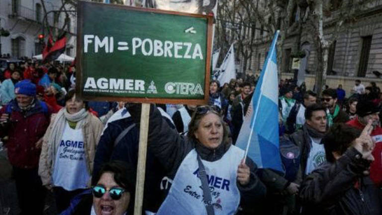 Argentina paralyzed by anti-IMF deal strike