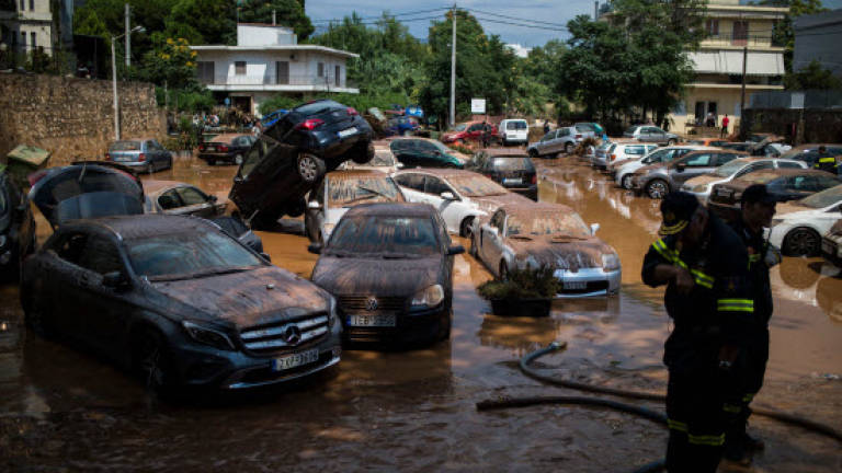 After fires, floods hit Greek capital
