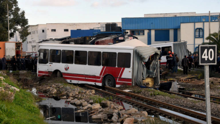 Five dead, many injured as train slams into bus near Tunis