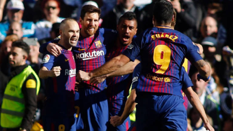Dominant Barca move 14 points clear of Madrid