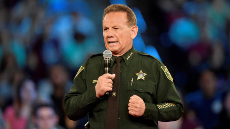 Armed deputy who failed to confront gunman at Florida school resigns