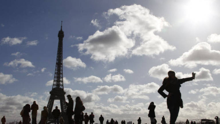 Some are wary after attacks, but Paris magic still enchants tourists