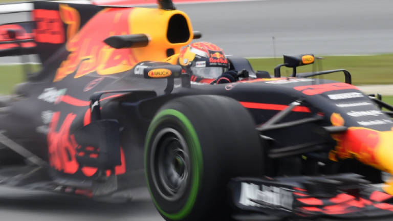 Verstappen sets pace in rain-hit Malaysia practice