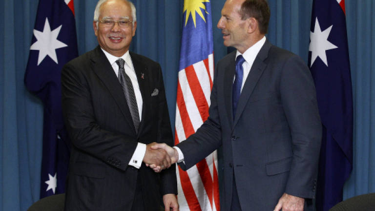 MH370: Abbott appeals to families for patience