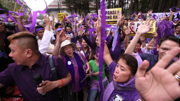 Philippine top court approves controversial birth control law