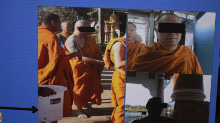 Alleged M'sian mastermind behind murder unmasked by 'Jesus Christ' tattoo