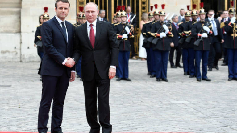Macron hosts Putin in latest diplomatic test