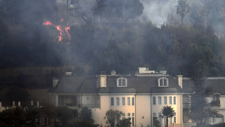Wildfire burns homes, winery in LA's posh Bel-Air neighbourhood