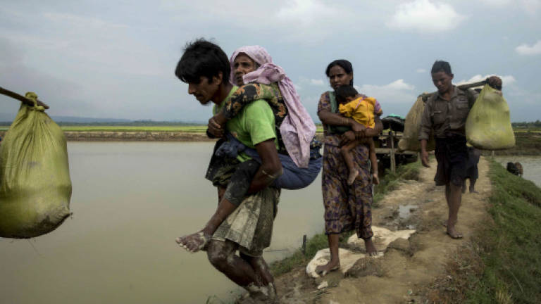 Crisis looms as nearly 125,000 refugees flood into Bangladesh