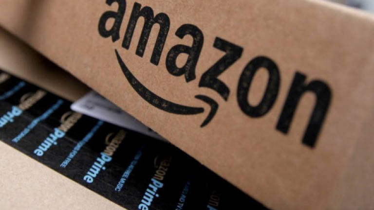 As Amazon slashes prices, Bezos sees jump in wealth