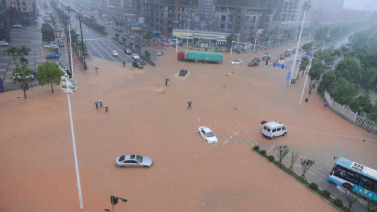 Deadly floods hit central, southern China