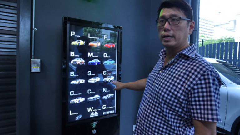 Singapore car 'vending machine' dispenses with tradition