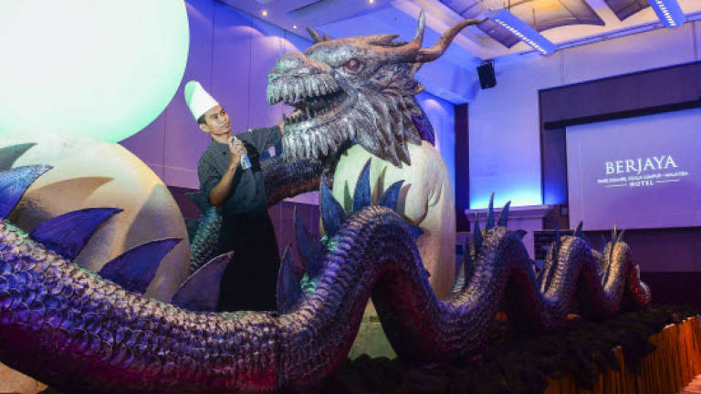 A magnificient dragon cake for Berjaya's dragon founder A magnificient dragon cake for Berjaya's dragon founder