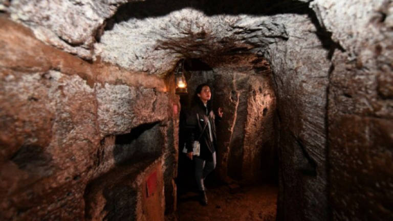 Unearthing dark history in Vietnam's war tunnels