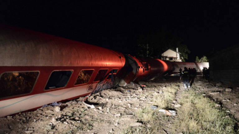 Death toll lowered after Greek train derails, hits house (Updated)