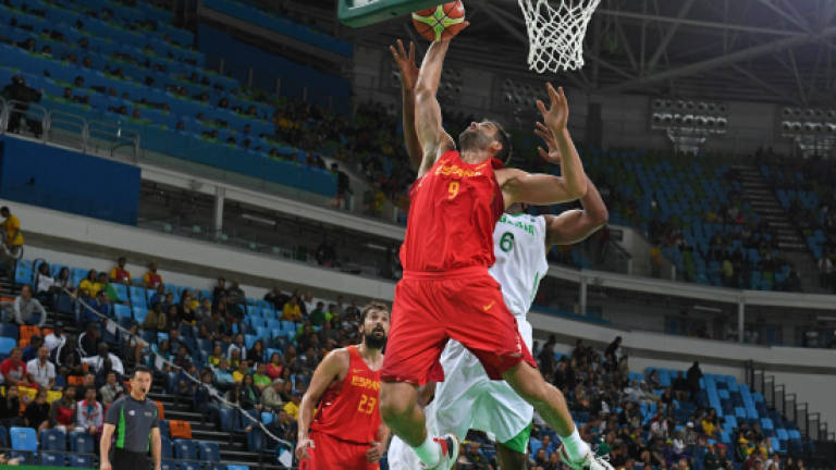 Spain get first win after security scare