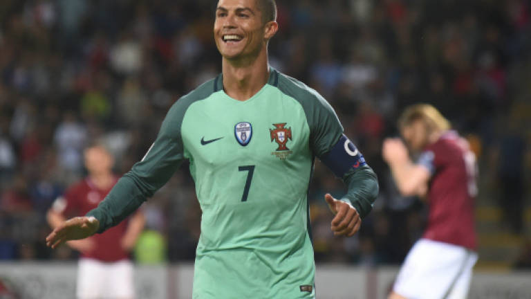 Ronaldo fires Portugal, France complicates path to Russia