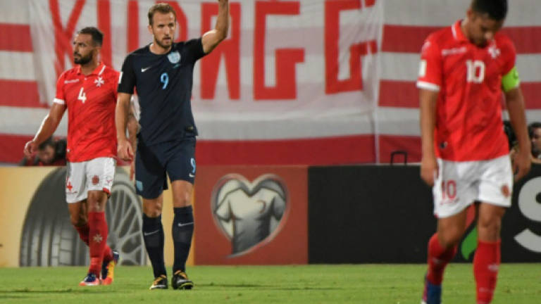 Kane's double saves England blushes