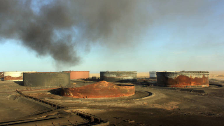 Rival force says it has seized third Libya oil port from unity govt