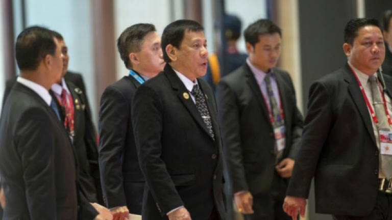 Obama meets Duterte after 'whore' slur