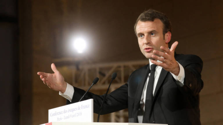 Macron sparks uproar with plea to restore 'bond' with Catholics