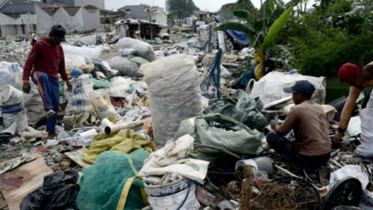 Indonesian scavengers scrape a living by recycling