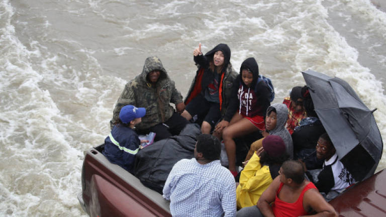 Texas flood toll mounts amid chemical blast fears