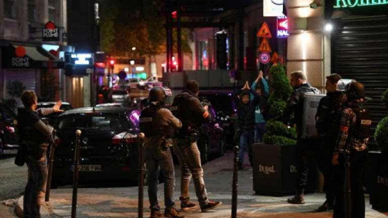Fears engulf French election after policeman shot in Paris