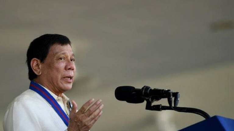 Philippines' Duterte likens rights chief to paedophile