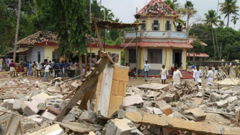 Five wanted over India temple disaster surrender to police