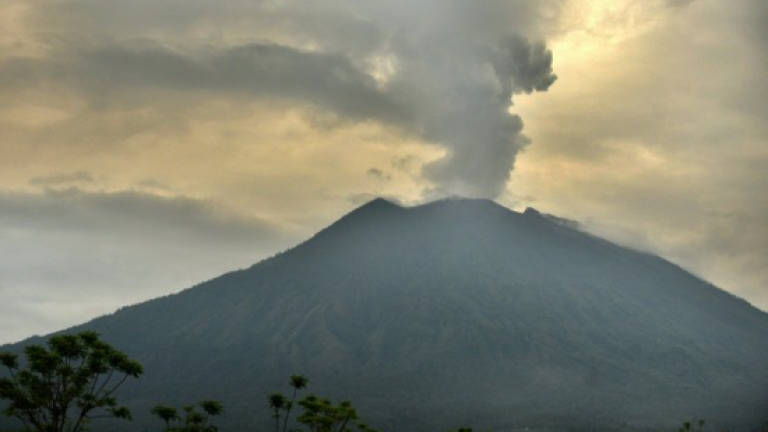 Flights resume as Bali's volcano-hit airport reopens