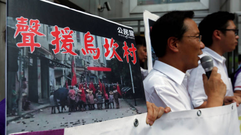 Hong Kong journalists 'detained and beaten' in China