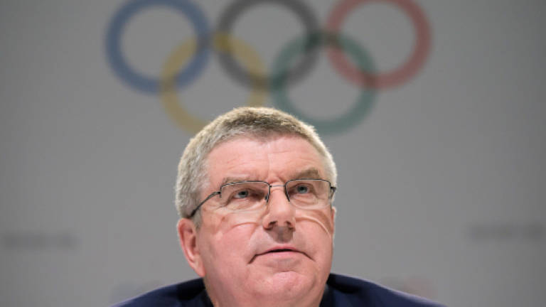 Olympic chief defends handling of corruption case