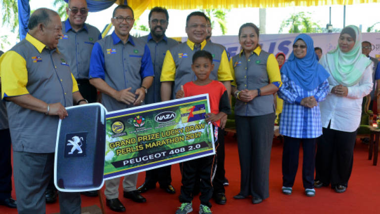 Year three pupil drives away with Peugeot 408 car in Perlis marathon lucky draw