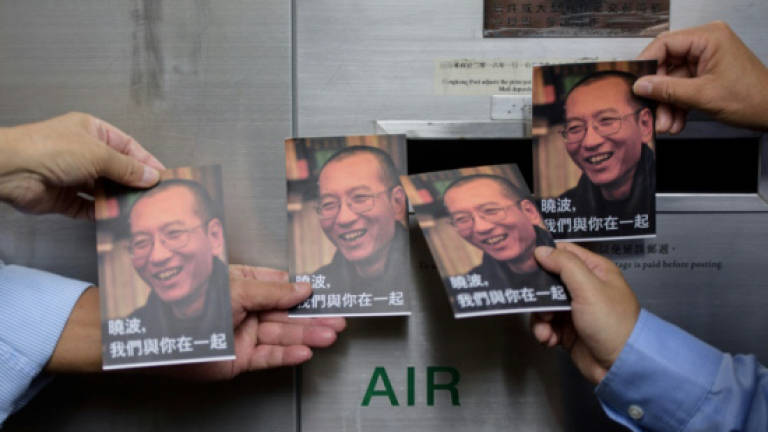 World reacts with praise, sadness to Liu death