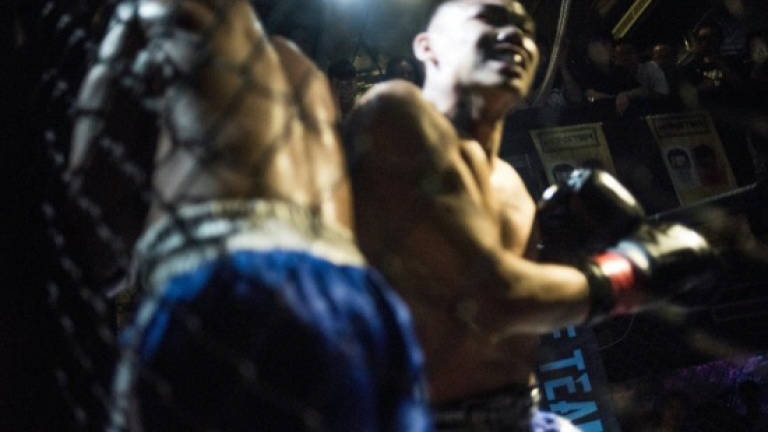 Bloodied at Chinese fight club for RM300