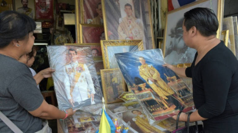 Thai charged in first royal slur case under new king