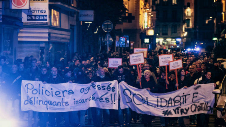 Third night of police protests in France