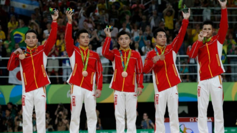 China reeling after loss of 'precious' gymnastics team crown